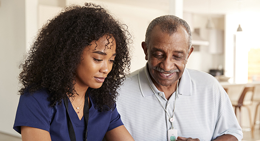 Healthcare worker w elderly patient